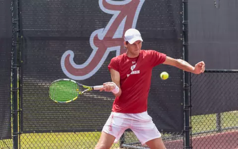 Collin Beduhn Swinging Racket at SEC/Big Ten Challenge