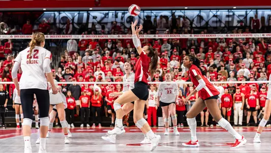 Izzy Ashburn sets the ball in match at Ohio State