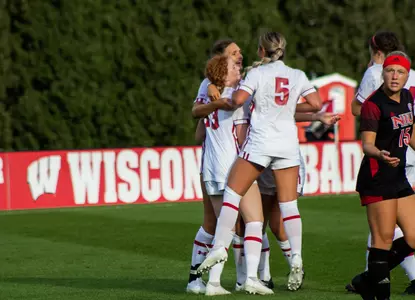 Dara Andringa (5) celebrates with Wisconsin Women's Soccer teammates