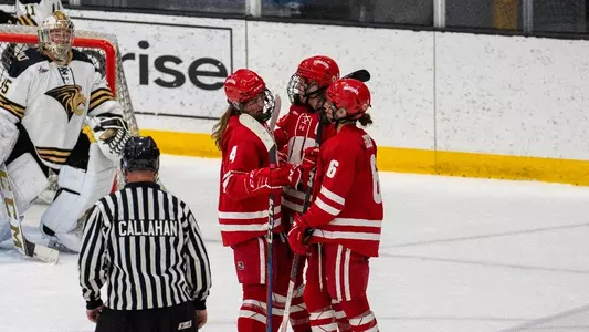 Wisconsin women's hockey celebrates a goal against Lindenwood at the Centene Community Ice Center on Sept. 28, 2023