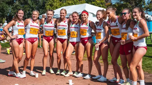 Womens cross-country team poses for a photo following Sean Earl Lakefront Invitational