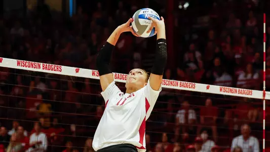 Izzy Ashburn back sets the ball in match against Tennessee at the UW Field House on September 3rd