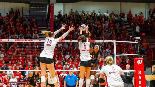 Caroline Crawford and Anna Smrek block the ball in match against Miami