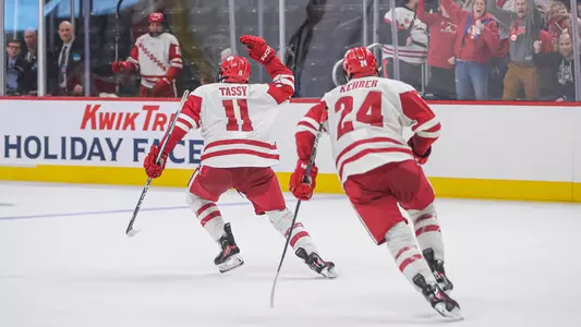 Simon Tassy and Anthony Kehrer celebrate scoring a goal at the 2023 Kwik Trip Holiday Face-Off.