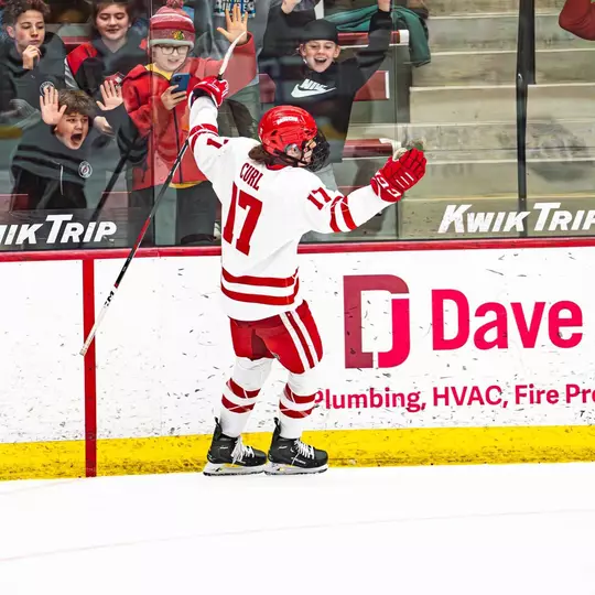 Britta Curl celebrates a goal against Merrimack