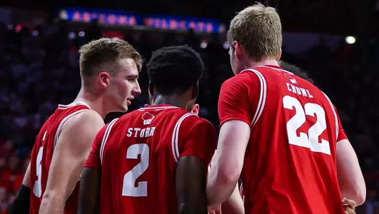 Badgers huddle during a road game
