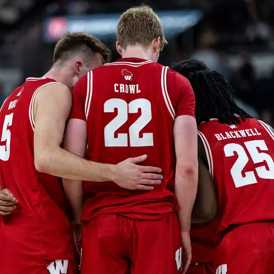 Badgers huddle during a road game