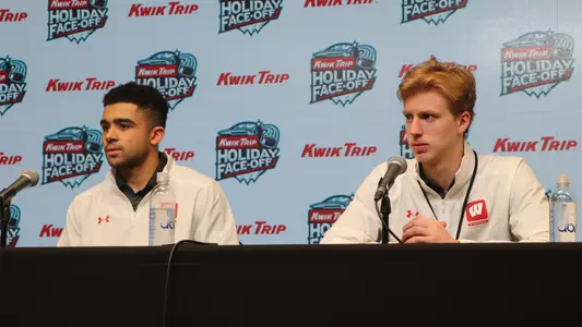 Simon Tassy and Kyle McClellan answer questions at a press conference after the 2023 Kwik Trip Holiday Face-Off tournament.