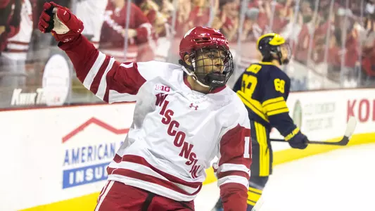 Simon Tassy celebrates scoring a goal against Michigan.