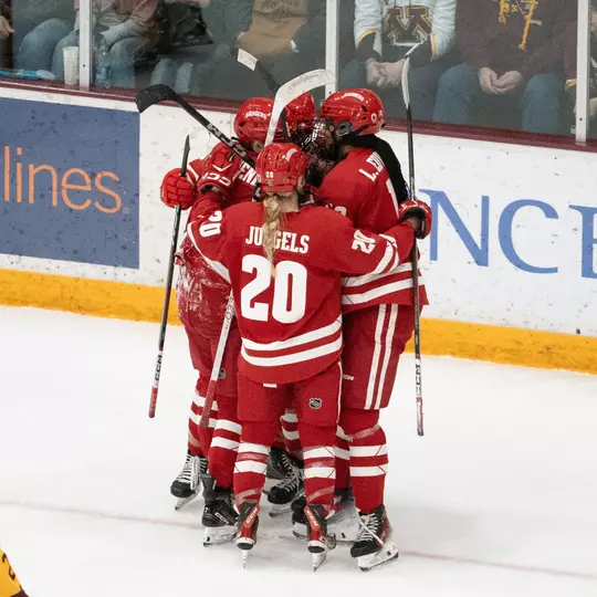 The Badgers celebrate a goal against Minnesota