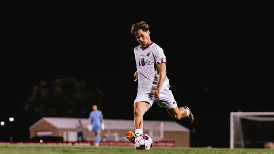 Matthew Zachemski kicks a ball far