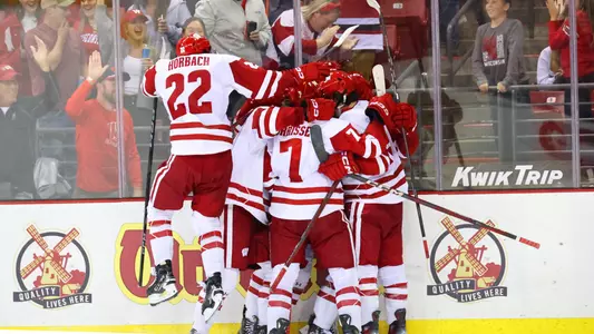 The Wisconsin men's hockey team celebrates an overtime win over Lindenwood