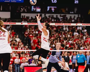 Carly Anderson sets the ball in match vs Marquette