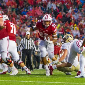 MADISON, WI - OCTOBER 14: Wisconsin Badger running back Jonathan Taylor (23) looks to break a tackle to secure the game durning an college football game between the Purdue Boilermakers and the Wisconsin Badgers on October 14th, 2017, at Camp Randall Stadium in Madison, WI.    (Photo by Dan Sanger/Icon Sportswire)