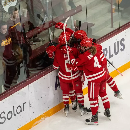 Women's Hockey celebrates a goal against Minnesota