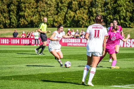 Ashley Martinez moves around defender