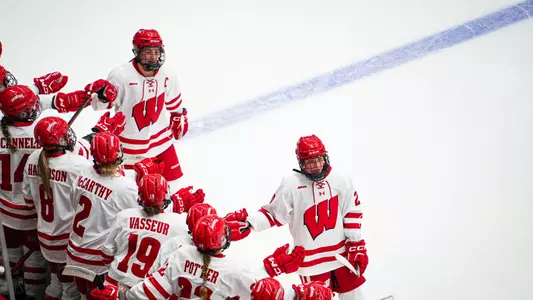 Caroline Harvey high-fives after a goal