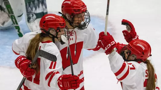 Lacy Eden, Kirsten Simms, Cassie Hall celebrate after a goal