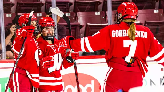 Casey O'Brien, Kelly Gorbatenko and Kirsten Simms celebrate scoring a goal at Boston College