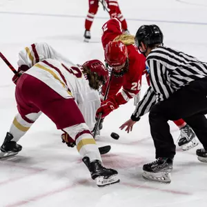 Casey O'Brien takes a faceoff against Boston College