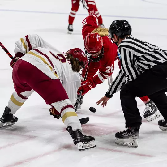 Casey O'Brien takes a faceoff against Boston College