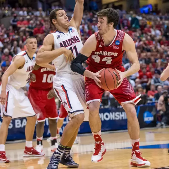 Arizona Wildcats forward Aaron Gordon (11) defends Wisconsin Badgers center Frank Kaminsky (44) during the Western Regional Final NCAA college basketball tournament game Saturday, March 29, 2014 in Anaheim, California. The Badgers won 64-63 (OT). (Photo by David Stluka)