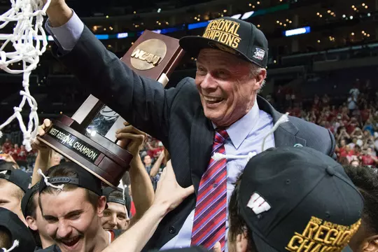 Wisconsin Badgers Head Coach Bo Ryan celebrates with his team after a college basketball Elite 8 West Regional game in the NCAA Tournament against the Arizona Wildcats Thursday, March 28, 2015, in Los Angeles.The Badgers won 85-78. (Photo by David Stluka)