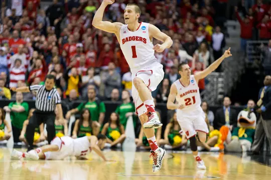 Wisconsin Badgers Ben Brust (1) and Josh Gasser (21) celebrate their victory during the third-round game in the NCAA college basketball tournament against the Oregon Ducks Saturday, April 22, 2014 in Milwaukee. The Badgers won 85-77. (Photo by David Stluka)