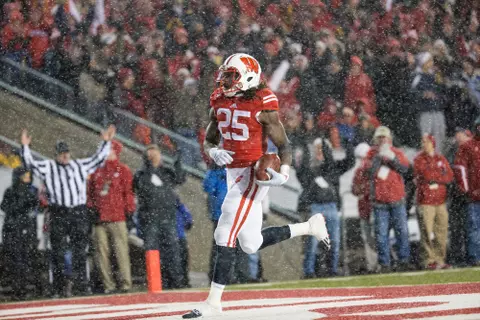 Wisconsin Badgers running back Melvin Gordon (25) scores on a 26-yard run to set the NCAA single-game rushing record with 408 yards during an NCAA football game against the Nebraska Cornhuskers Saturday, November 15, 2014, in Madison, Wis. (Photo by David Stluka)