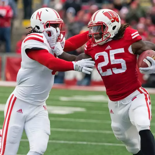 Wisconsin Badgers running back Melvin Gordon (25) stiff arms a defender during an NCAA football game against the Nebraska Cornhuskers Saturday, November 15, 2014, in Madison, Wis. The Badgers won 59-24. (Photo by David Stluka)