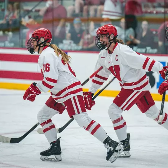 Caroline Harvey and Casey O'Brien skate together against Lindenwood