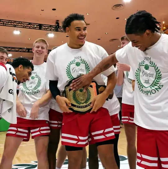 John Tonje celebrates with the Greenbrier Tip-Off MVP belt