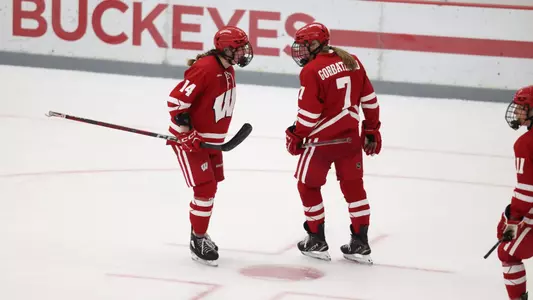 Maggie Scannell and Kelly Gorbatenko talk during a game against Ohio State