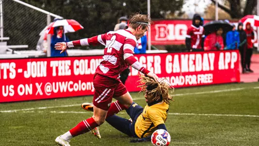 Birgir Baldvinsson dribbles the ball against Michigan