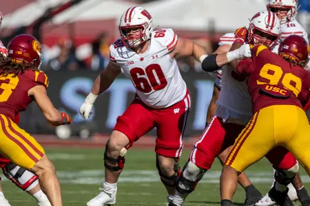 Wisconsin Badgers offensive lineman Joe Huber (60) blocks during a Big Ten Conference NCAA college football game against the USC Trojans, Saturday, Sept. 28, 2024, in Los Angeles, Cal. USC won 38-21. (Photo by David Stluka/Wisconsin Athletic Communications)