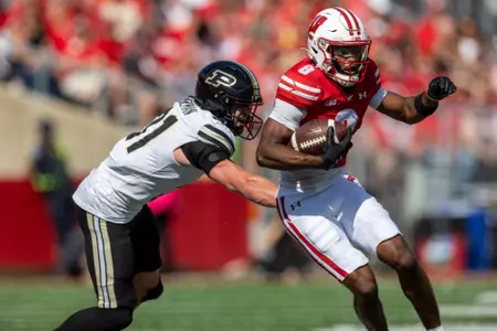 Wisconsin Badgers wide receiver Vinny Anthony II (8) carries the ball during a Big Ten Conference NCAA college football game against the Purdue Boilermakers, Saturday, Oct. 5, 2024, in Madison, Wis. The Badgers won 52-6. (Photo by David Stluka/Wisconsin Athletic Communications)
