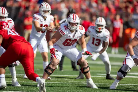 Wisconsin Badgers offensive lineman Joe Huber (60) blocks during a Big Ten Conference NCAA college football game against the Rutgers Scarlet Knights, Saturday, Oct. 12, 2024, in Piscataway, NJ. The Badgers won 42-7. (Photo by David Stluka/Wisconsin Athletic Communications)