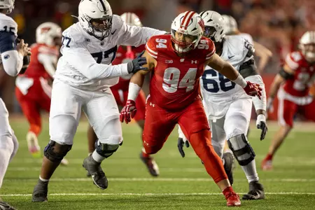 Wisconsin Badgers defensive lineman Elijah Hills (94) pressures the quarterback during a Big Ten Conference NCAA college football game against the Penn State Nittany Lions, Saturday, Oct. 26, 2024, in Madison, Wis. The Nittany Lions won 28-13. (Photo by David Stluka/Wisconsin Athletic Communications)