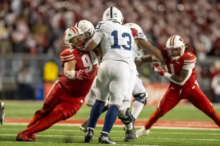 Wisconsin Badgers defensive lineman Elijah Hills (94) makes a tackle during a Big Ten Conference NCAA college football game against the Penn State Nittany Lions, Saturday, Oct. 26, 2024, in Madison, Wis. The Nittany Lions won 28-13. (Photo by David Stluka/Wisconsin Athletic Communications)