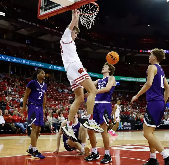 November 4, 2024: Wisconsin Badgers forward Nolan Winter (31) dunks the ball during the season opener between the Holy Cross Crusaders and the Wisconsin Badgers at the Kohl Center in Madison, WI. Darren Lee/CSM