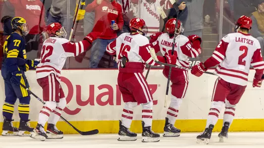 Owen Lindmark and the Wisconsin men's hockey team celebrate scoring a goal vs. Michigan at the Kohl Center