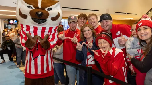 Badger fans celebrate at the 2024 Big Ten Championship Blue Carpet event