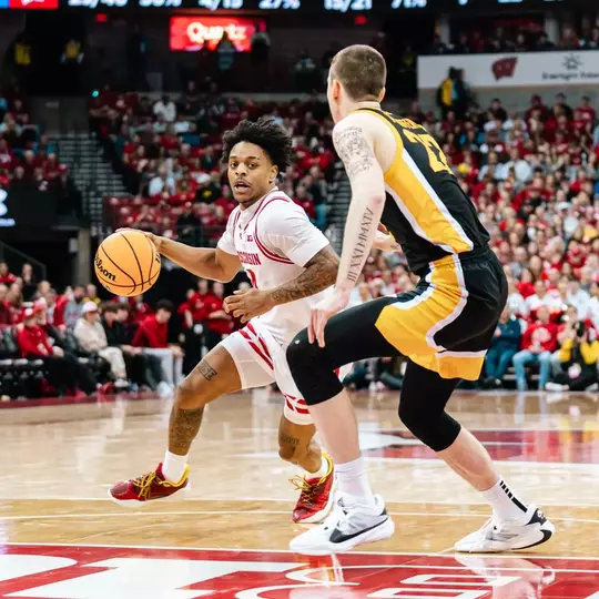 Kamari McGee drives against Iowa in 2023-24