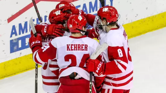 Wisconsin men's hockey team celebrates scoring a goal