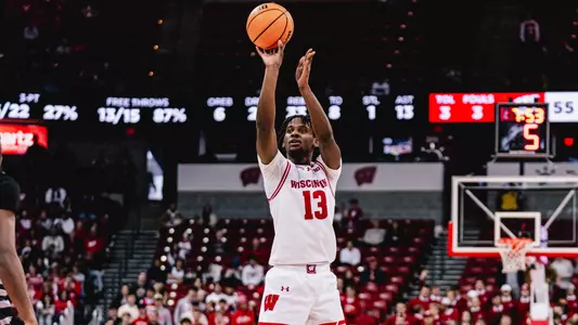 Xavier Amos shoots a three against Chicago State