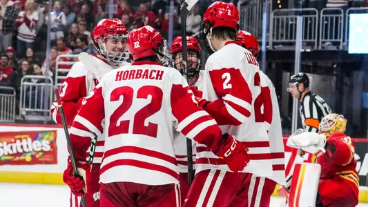 Wisconsin men's hockey team celebrates scoring a goal against Ferris State at the 2024 Kwik Trip Holiday Face-Off