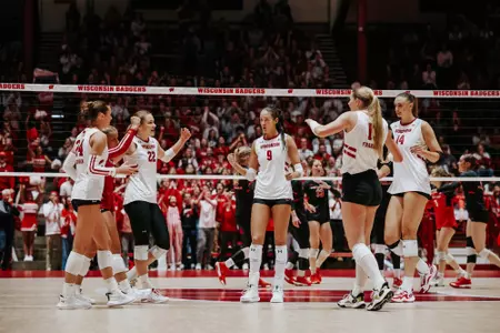 The Wisconsin volleyball team celebrates a point at the Field House