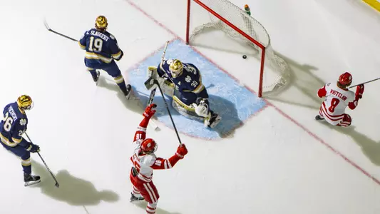 William Whitelaw and Tyson Dyck celebrate scoring a goal against Notre Dame.
