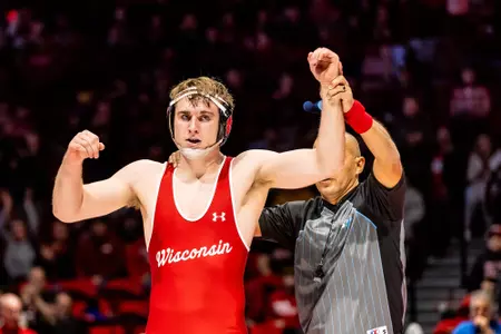 Shane Liegel, Wisconsin Wrestling, has his arm raised after winning during the Wisconsin Badgers wrestling team dual vs. Ohio State at the Wisconsin Field House at the University of Wisconsin- Madison on Jan. 21, 2024. (Photo by Taylor Wolfram / Wisconsin Athletics Communications)