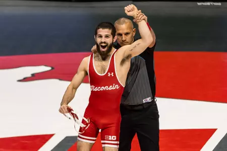 Eric Barnett, Wisconsin Wrestling, has his arm raised by the referee after defeating his Ohio State opponent with a pin in 32 seconds at the UW Field House in Madison, Wisconsin on Jan. 21, 2024.